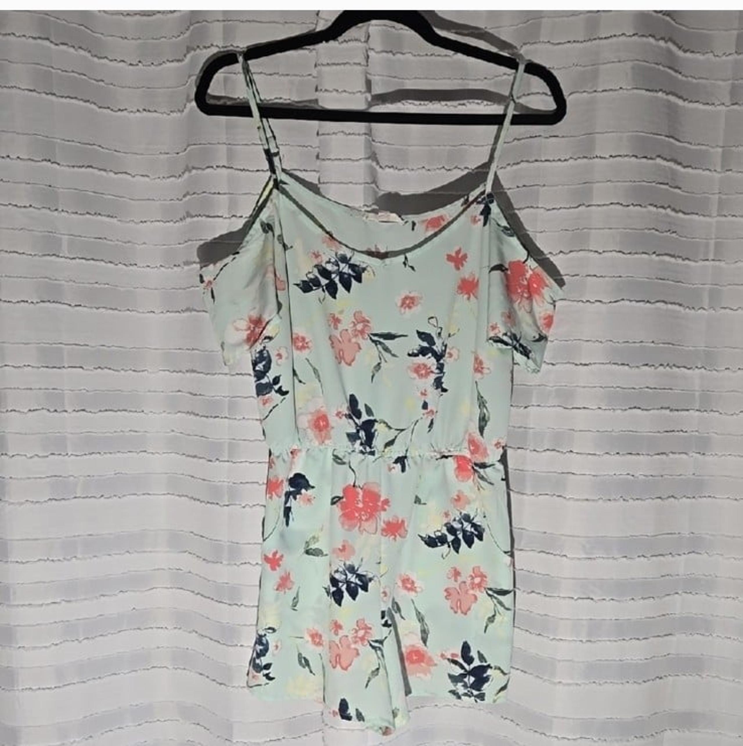 Light blue and floral pattern romper by MINE