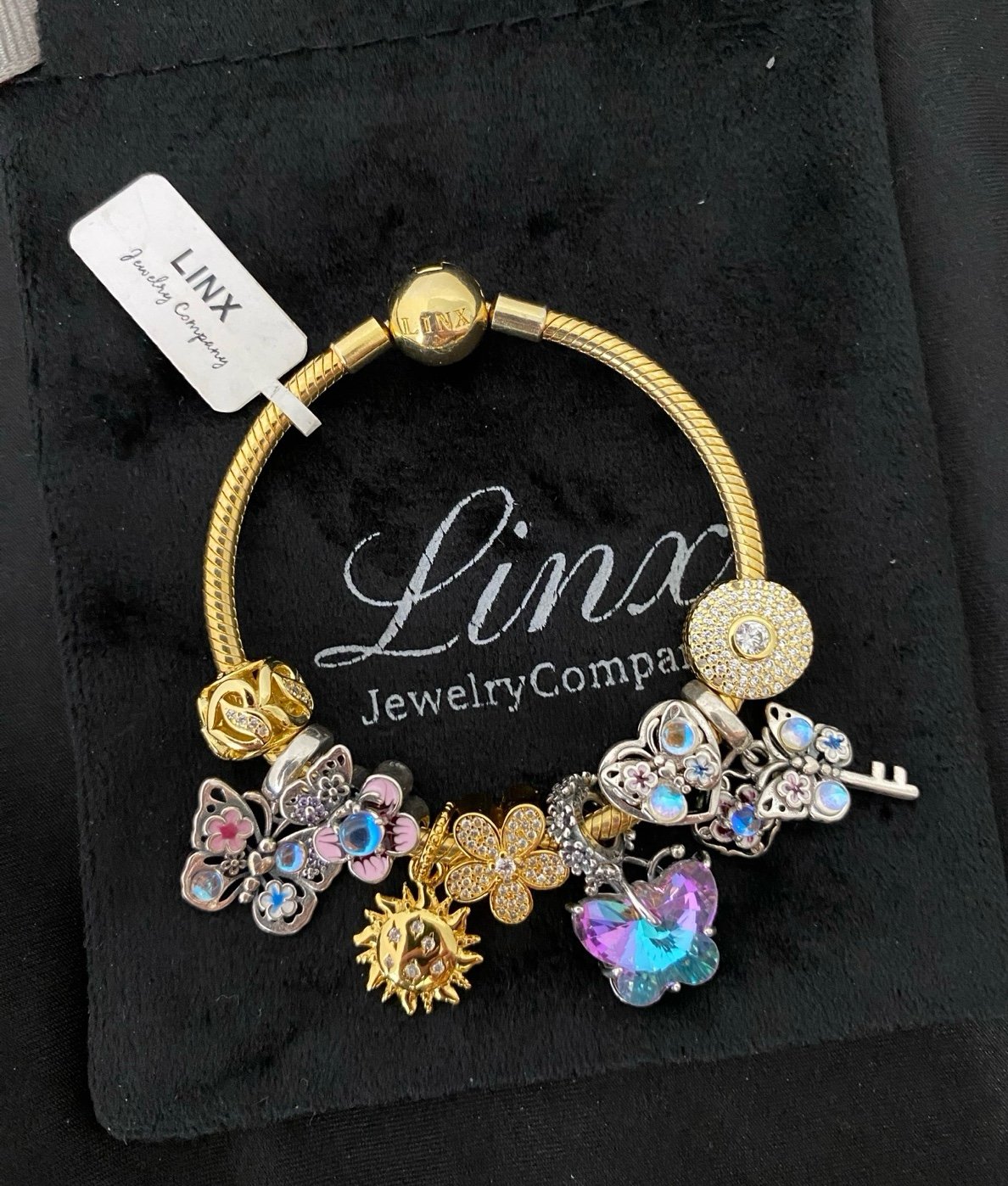 Linx Gold Bracelet with Gold Pink Blue and Purple Iridescent Themed Charms