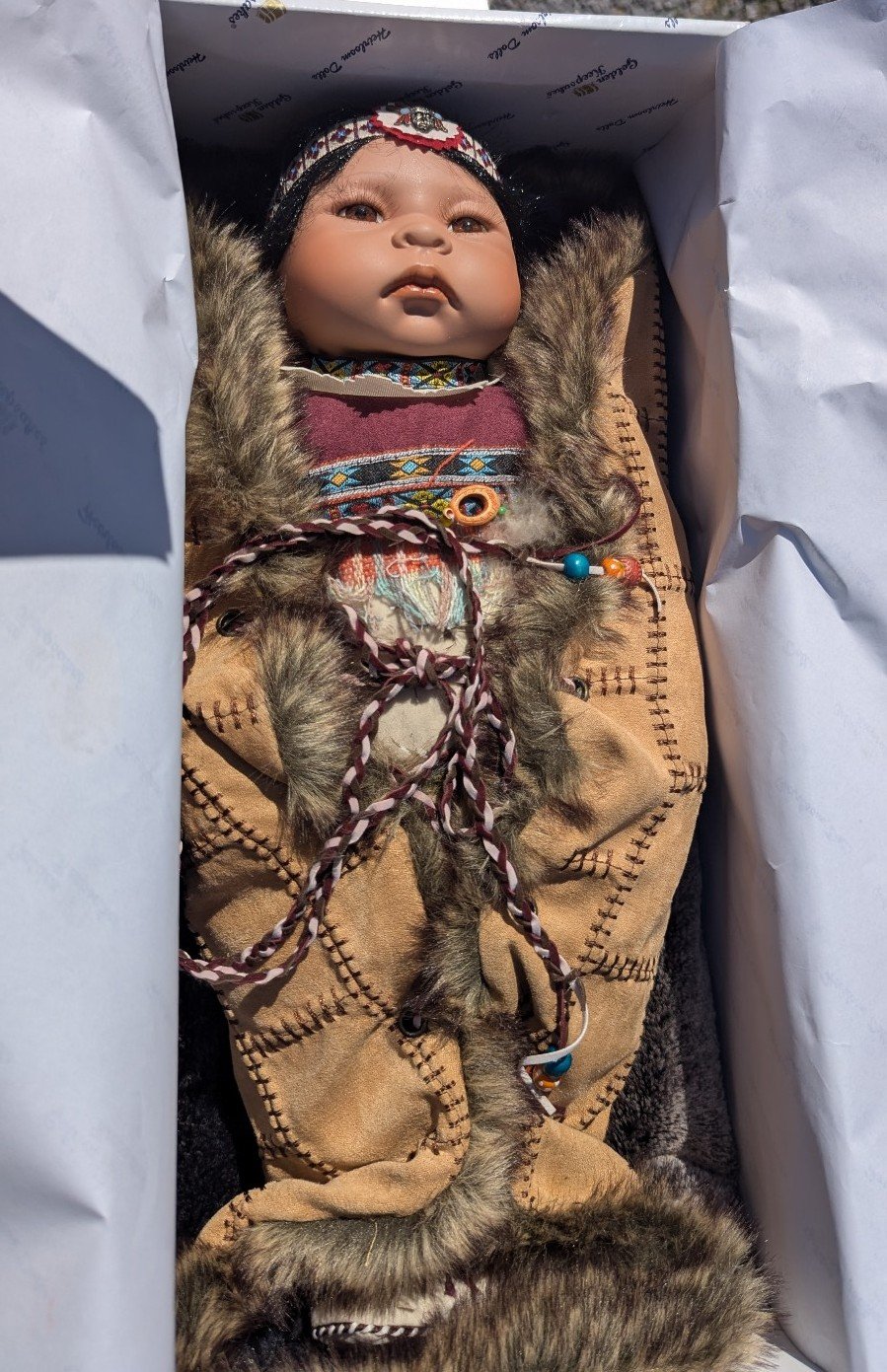 Golden keepsake doll
