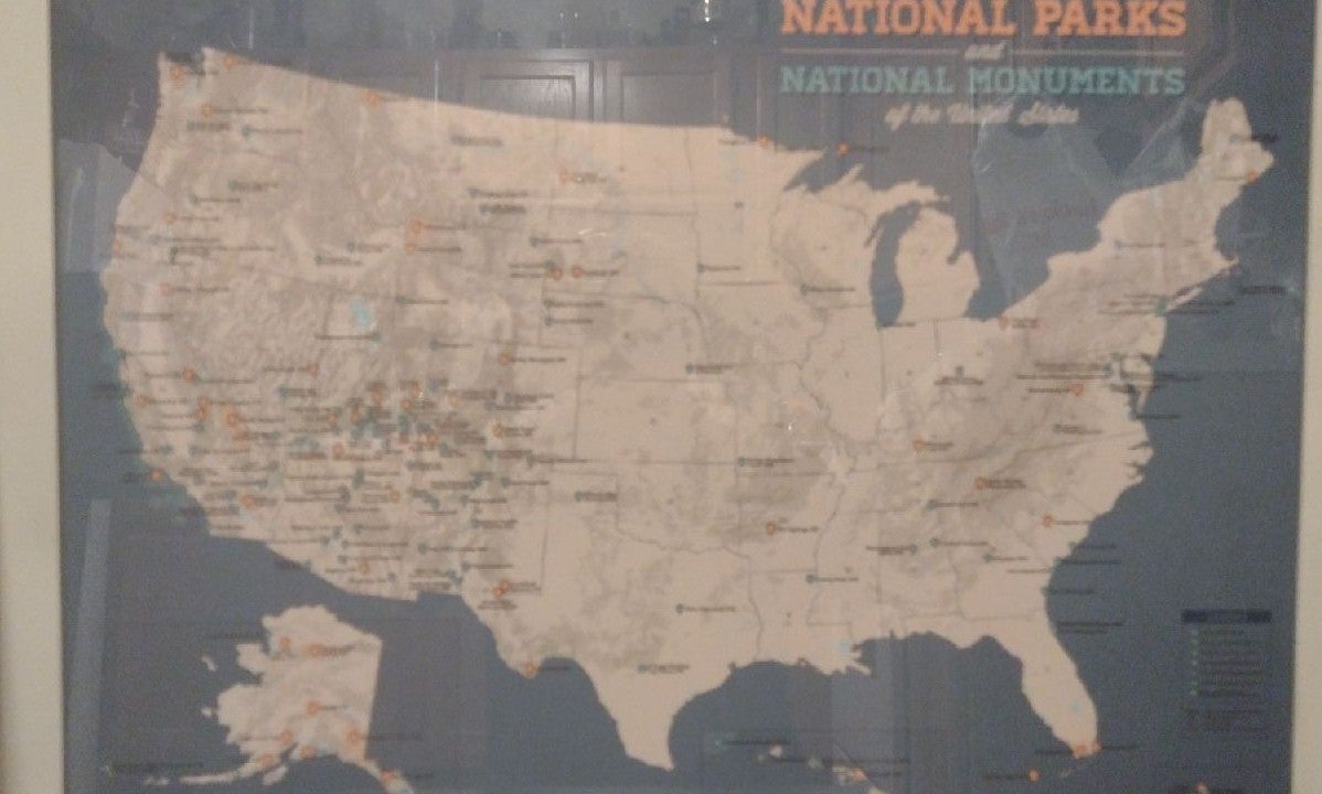 Framed map of US featuring National parks and National Monuments.