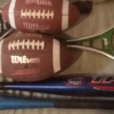 Mixed sporting goods tennis football baseball tee ball