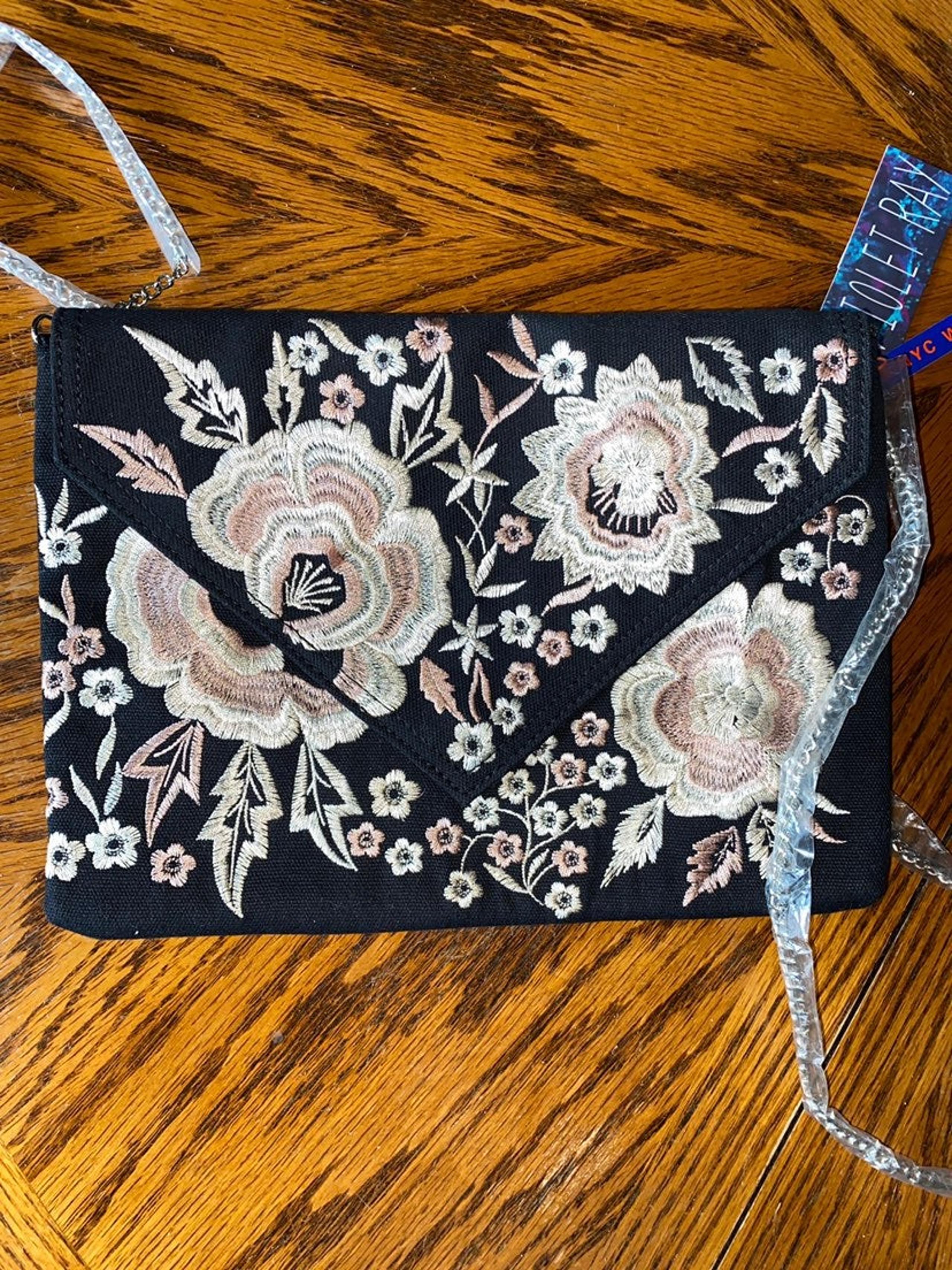 Violet ray clutch purse