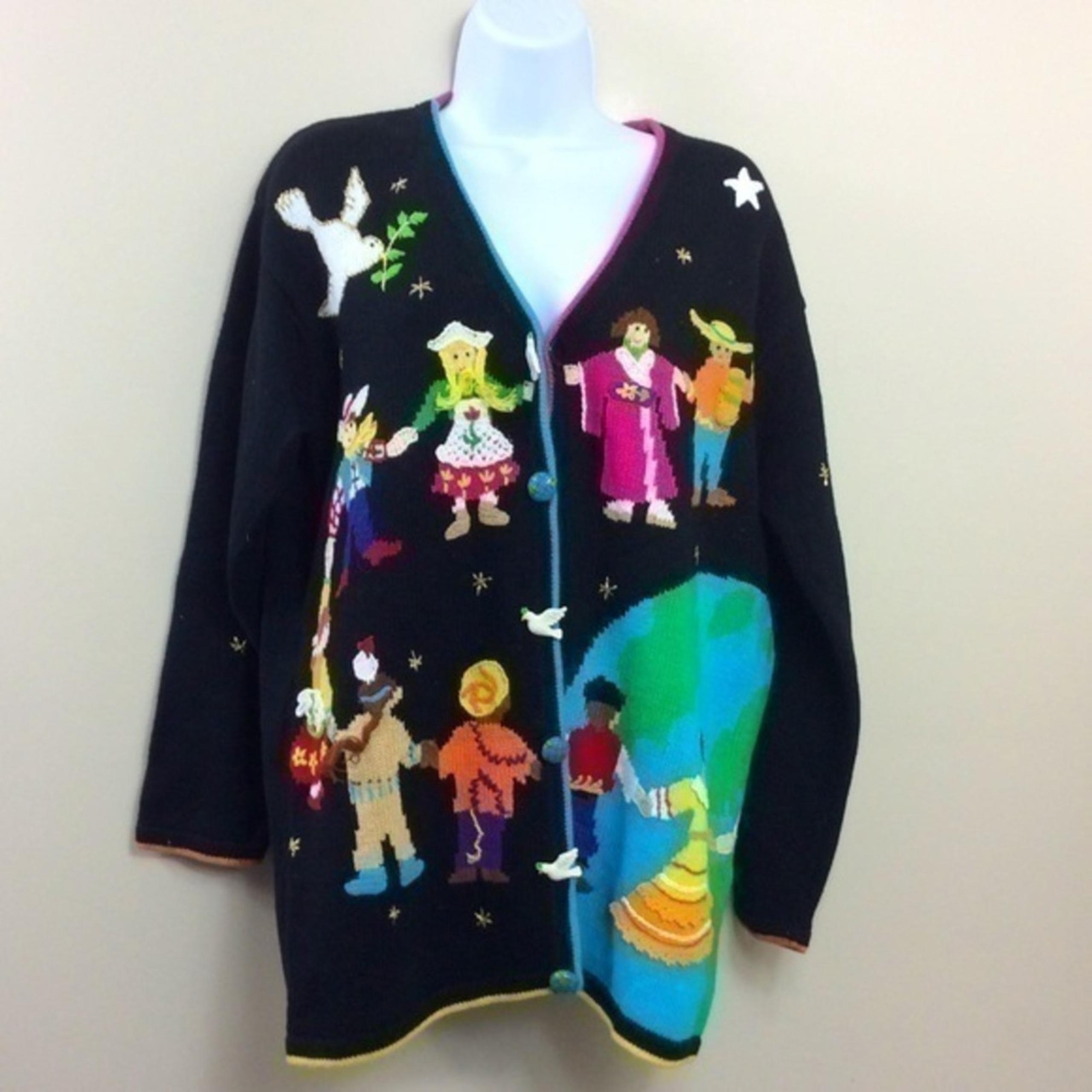 Storybook Knits children around the world cardigan. Black Medium.
