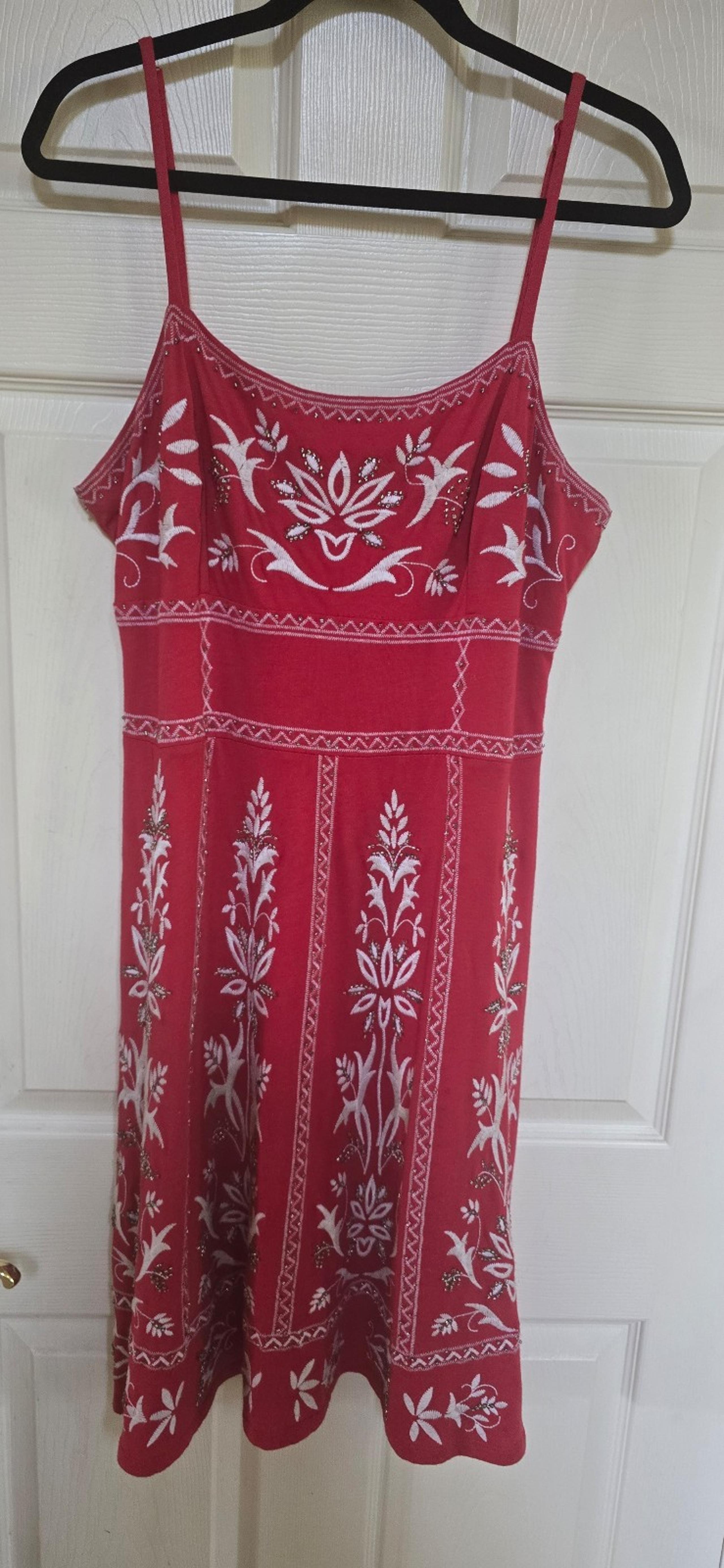 INC Red dress with white embroidery. 42 inch  long.