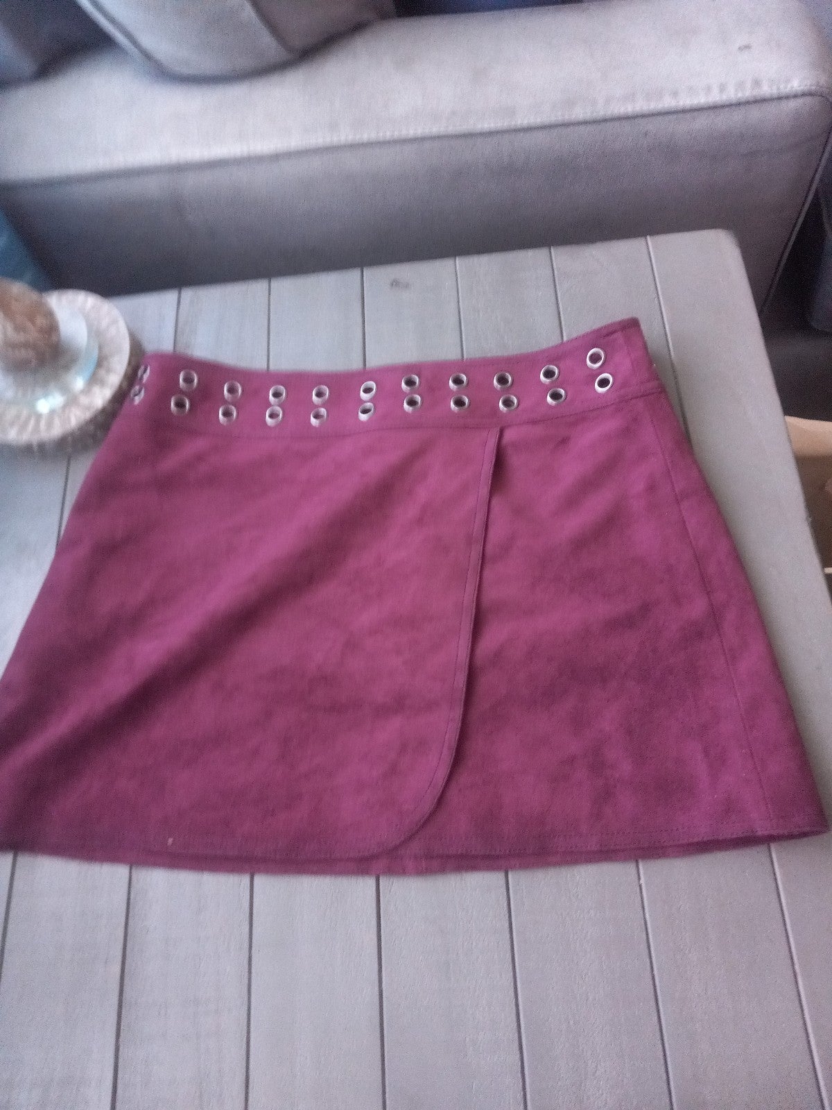 A burgundy short skirt