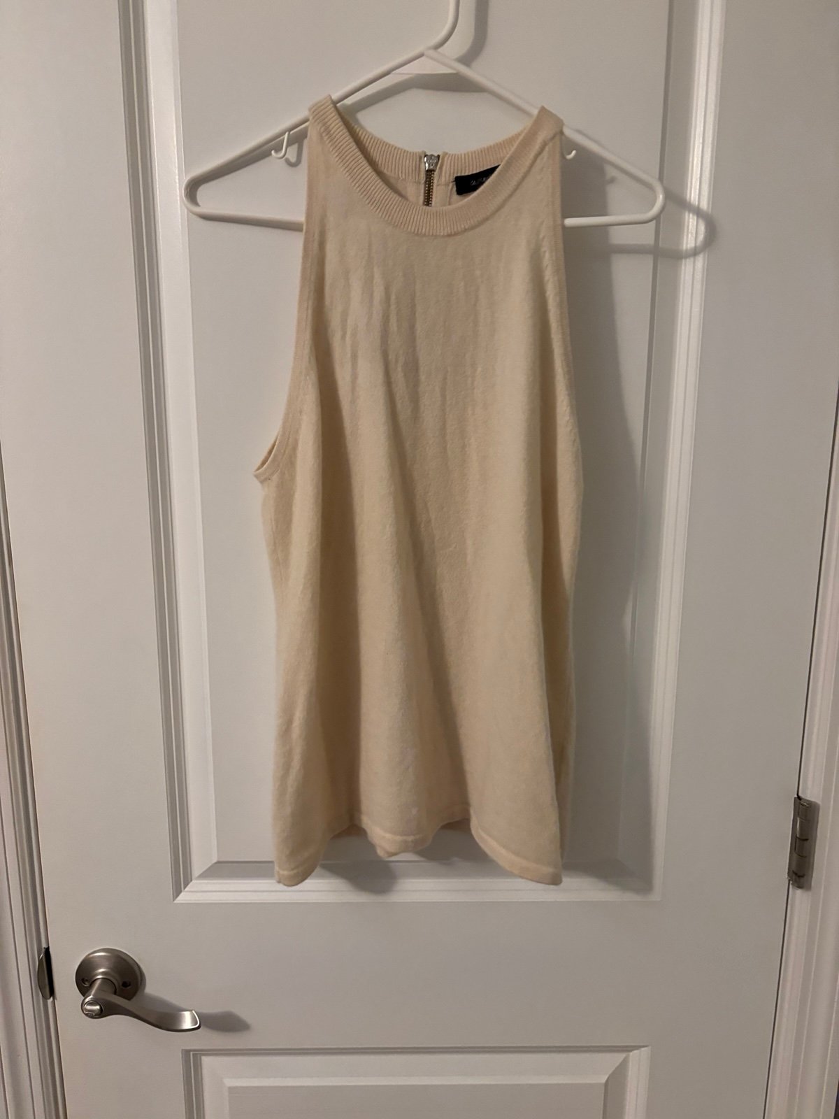 cashmere Saks Fifth Avenue cream sleeveless top. Perfect for any occasion