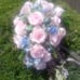A cascade style silk flower bridal bouquet flooded with loving pink roses,