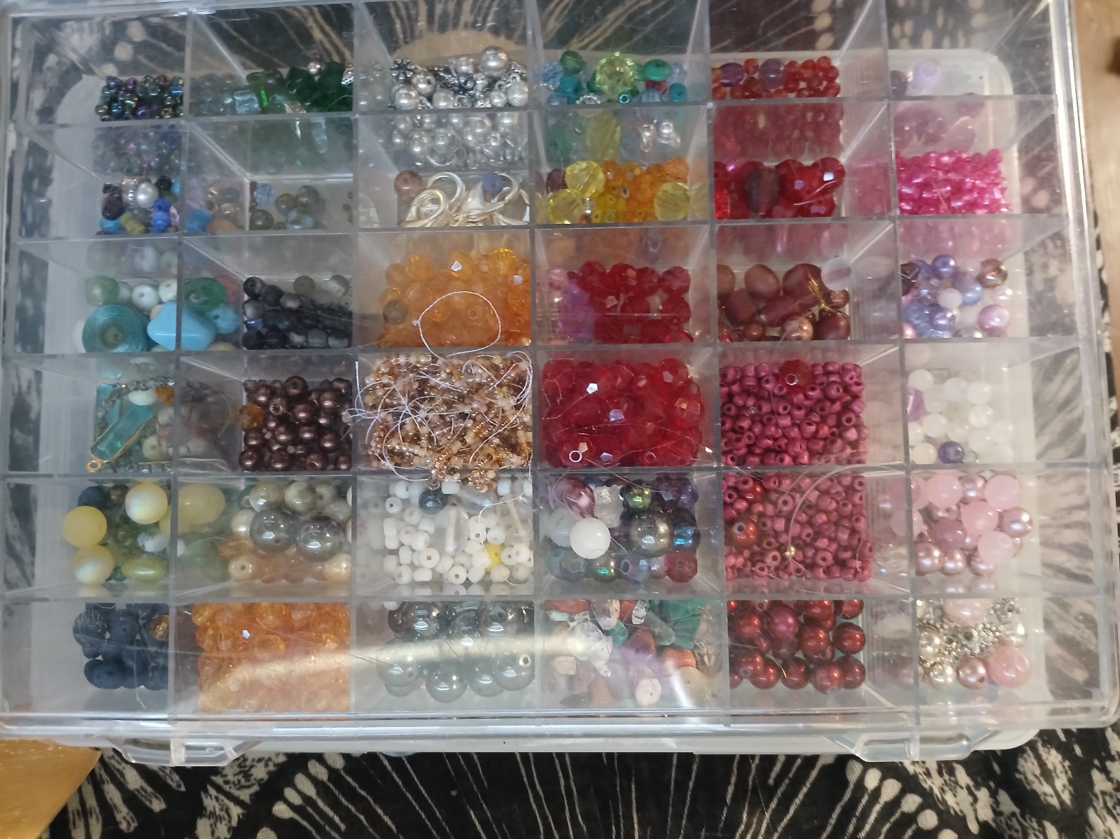 Container packed with beads over 2 lbs.