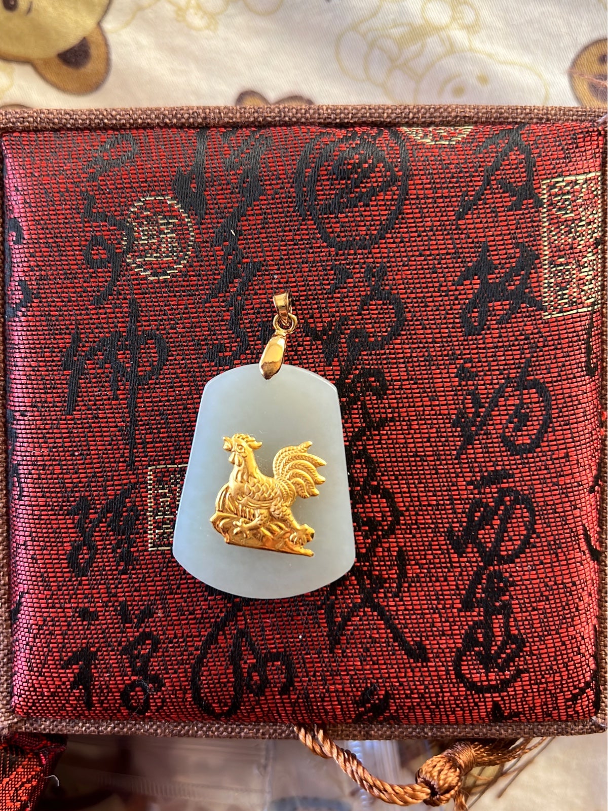 Jade and gold pendant