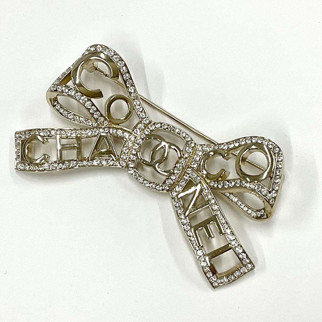 Chanel Brooch Coco Mark Rhinestone Ribbon Logo Gold