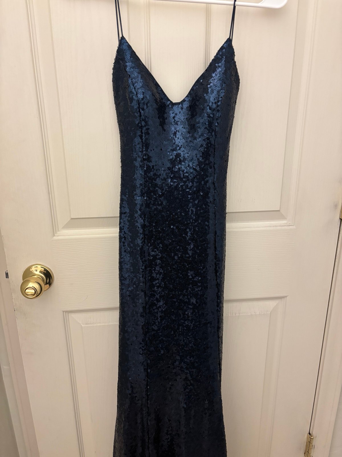 Dark blue sequin dress with open back.