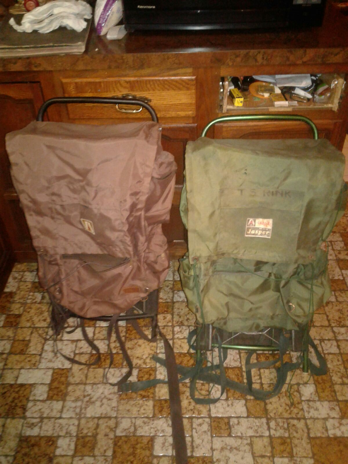 A pair of vintage academy 8 compartment hiking backpack
