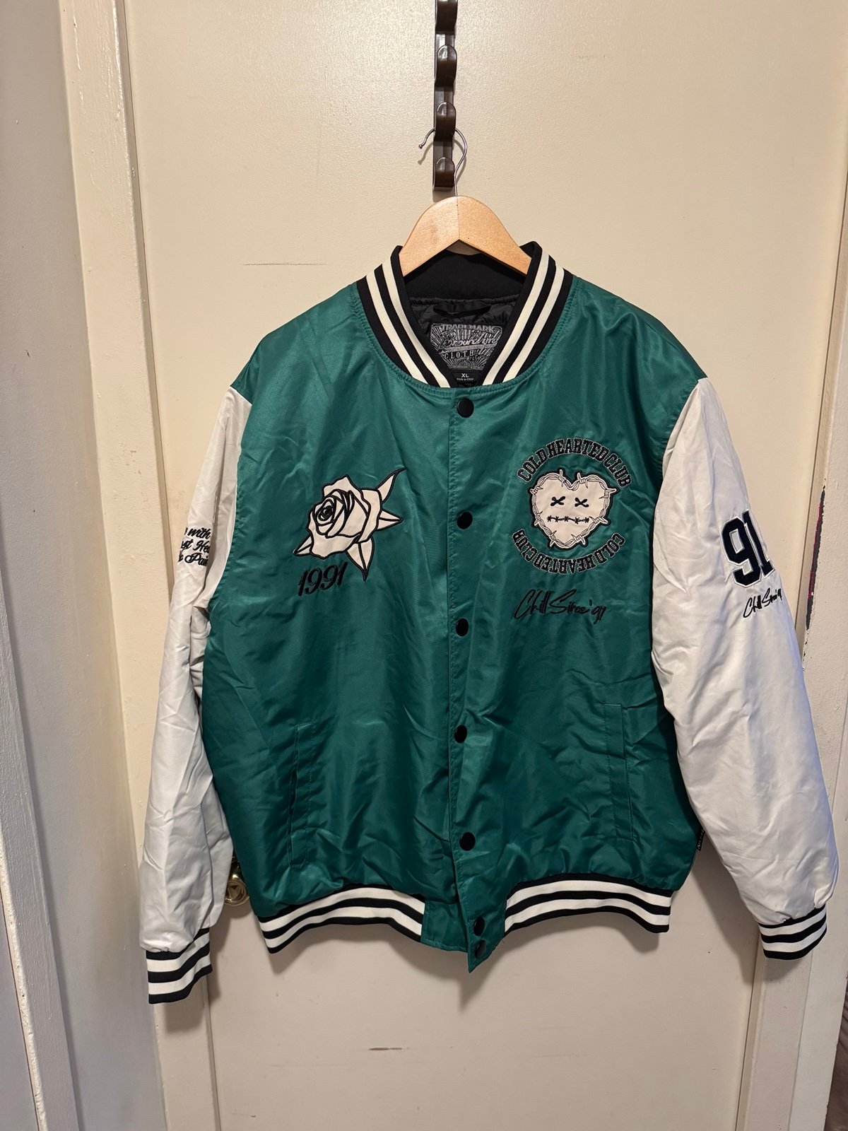Varsity jacket the cold hearted club.
