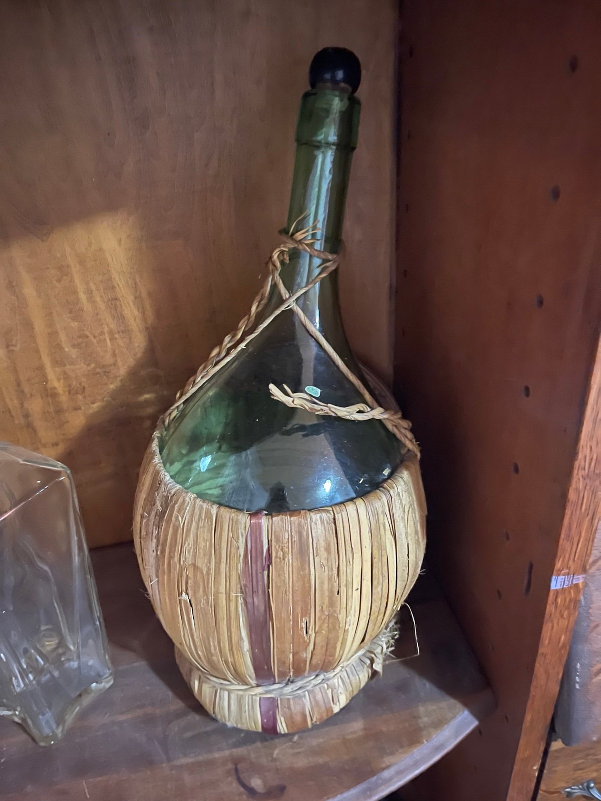 Italian wine bottle with wicker basket.