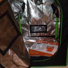 Inside plant growing unit with grow light.never used