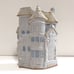 Glazed Stoneware vase house on street