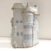 Glazed Stoneware vase house on street
