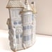 Glazed Stoneware vase house on street