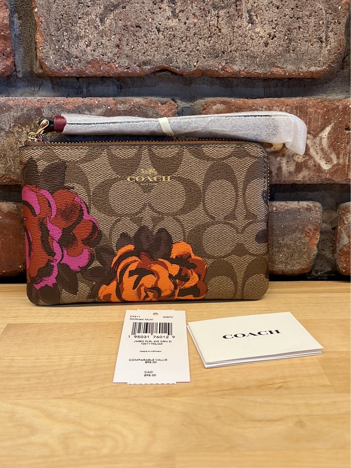 Coach Corner Zip Wristlet In Signature Canvas With Jumbo Floral Print CF311