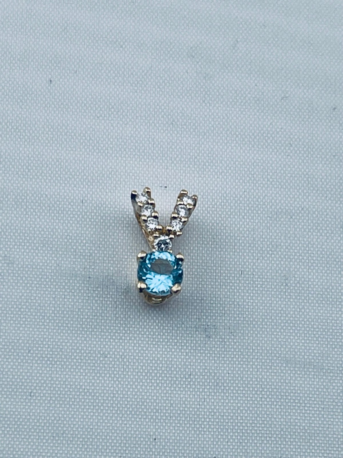 Vintage quarter carat topaz and 1/10 of a carrot diamond pendant 14kt gold