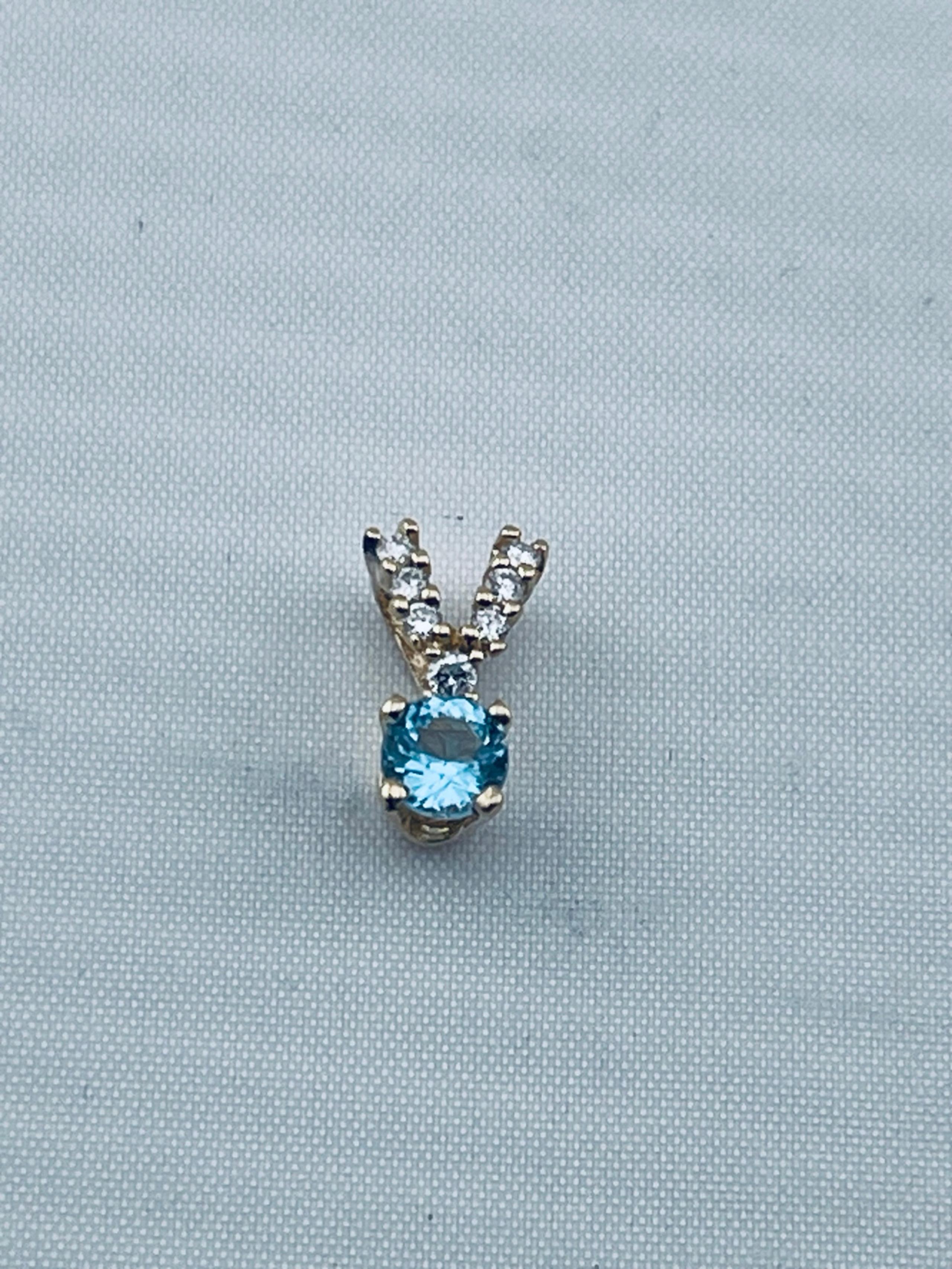 Vintage quarter carat topaz and 1/10 of a carrot diamond pendant 14kt gold