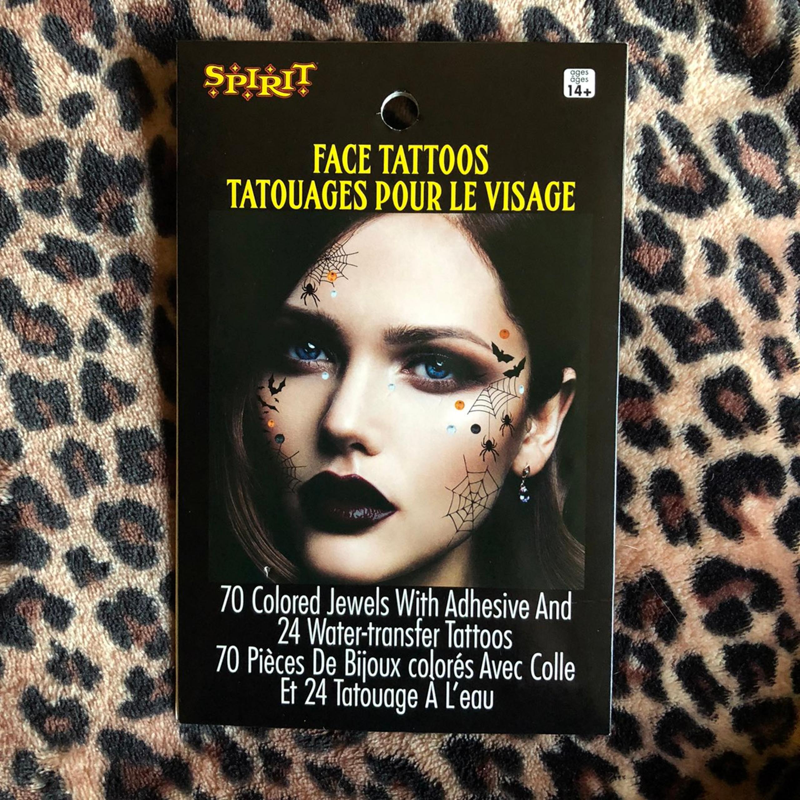 Halloween face tattoos and jewels