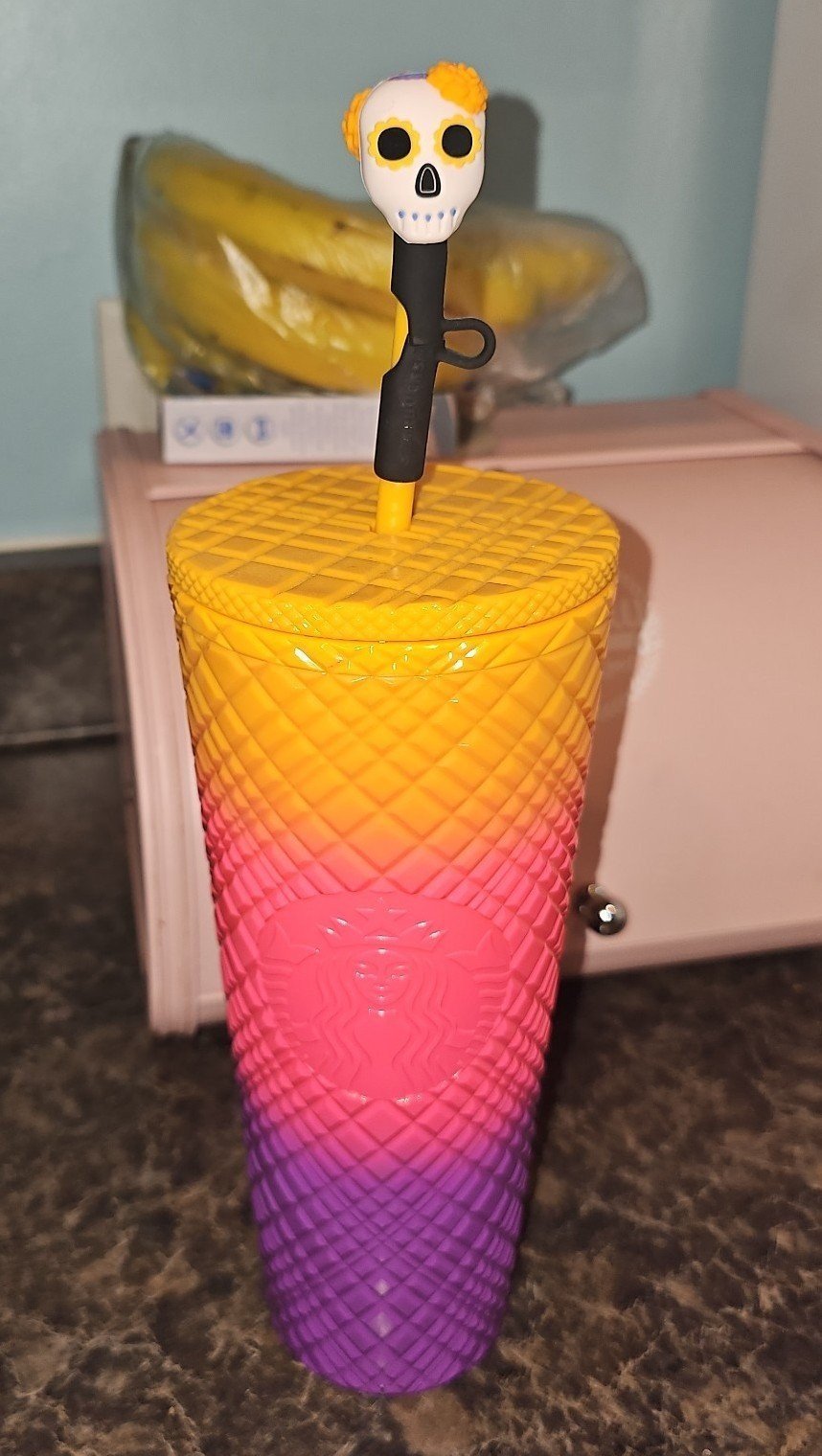 Starbucks limited edition gradient cup with day of the dead skull topper.