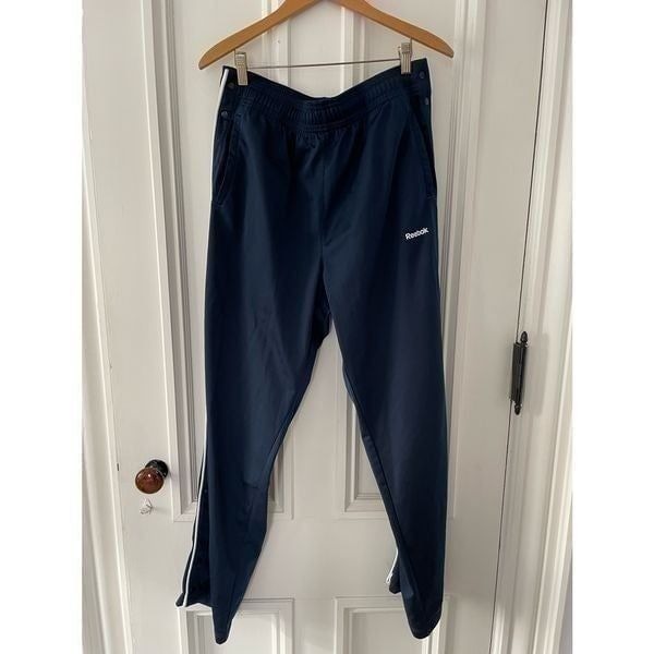 Reebok mens track pants navy with blue stripe and snaps on sides