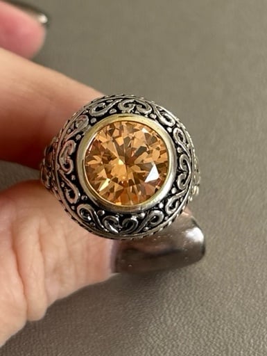 Sterling silver ring with orange stone and intricate design