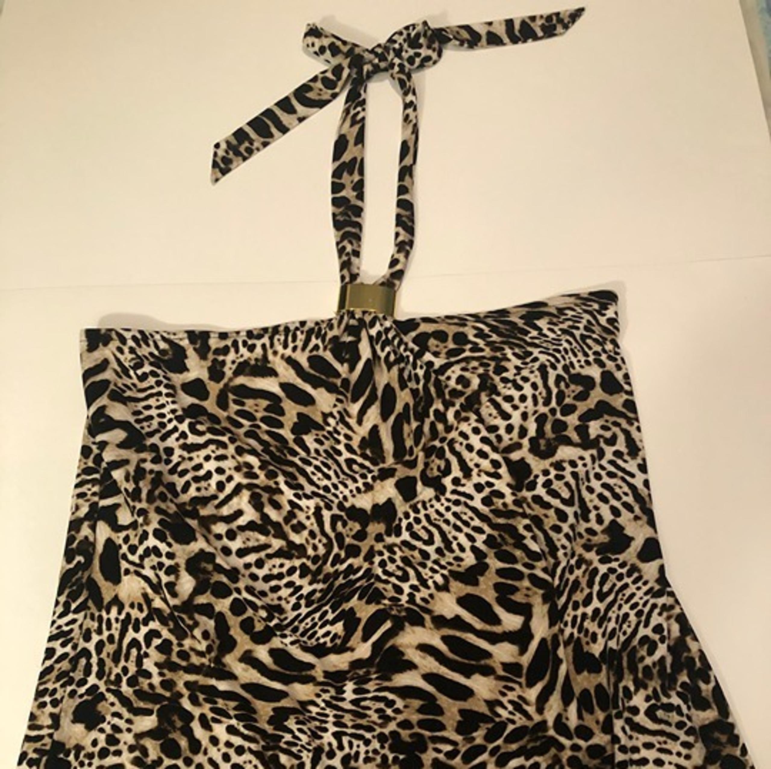 Calvin Klein Animal print halter top with gold clip at neckline and tie. Size L