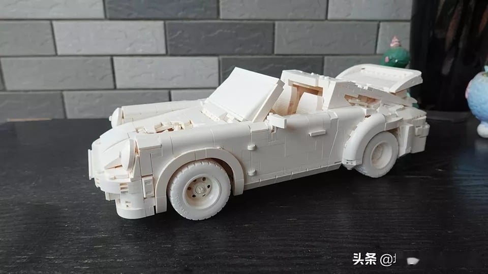 CADA Daniel Arsham ERODED Porsche 911 1:8 Race Car Building Kit, limited Ivory