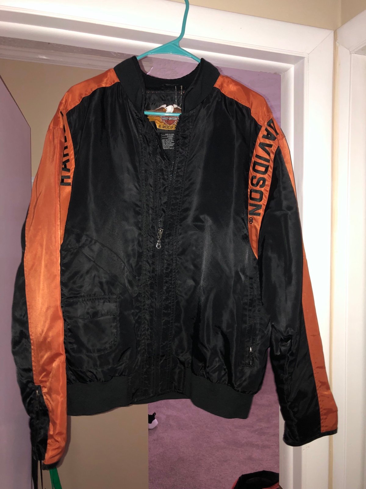 Man’s Black and Orange Harley Davidson Touring Jackets. Size L