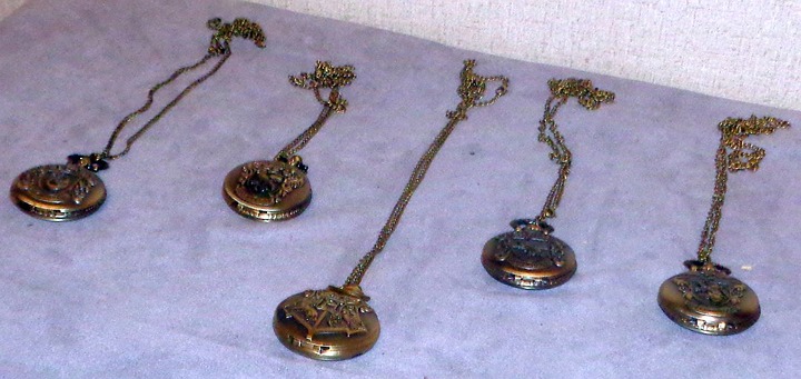Set Of Five Harry Potter Themed Pocket Watches Hogwarts Gryffindor Ravenclaw
