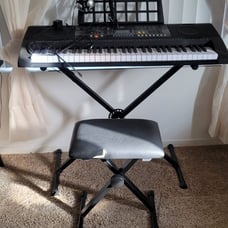 Electric Organ like new. Used twice. Bench has a small slit but everything else