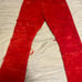 Red stacked jeans