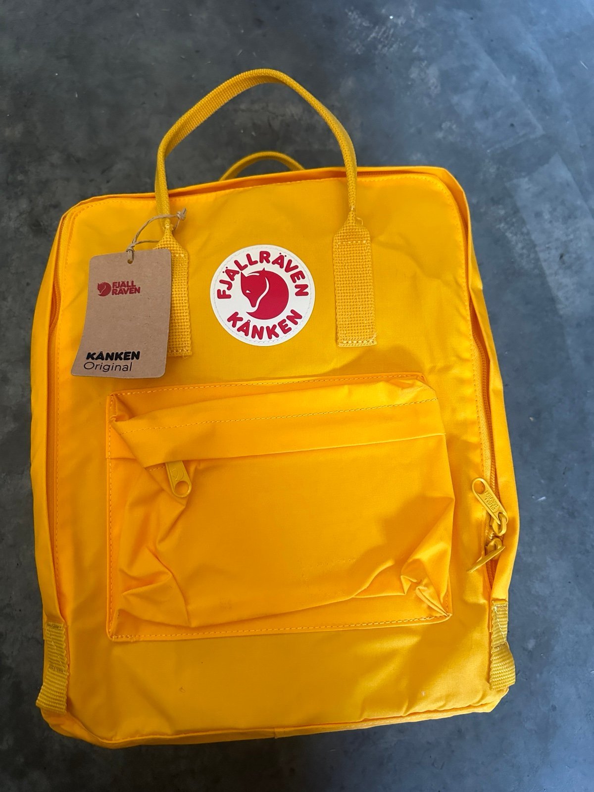 Fjallraven Kanken yellow waterproof bag