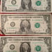 One dollar bills with triple bank note numbers