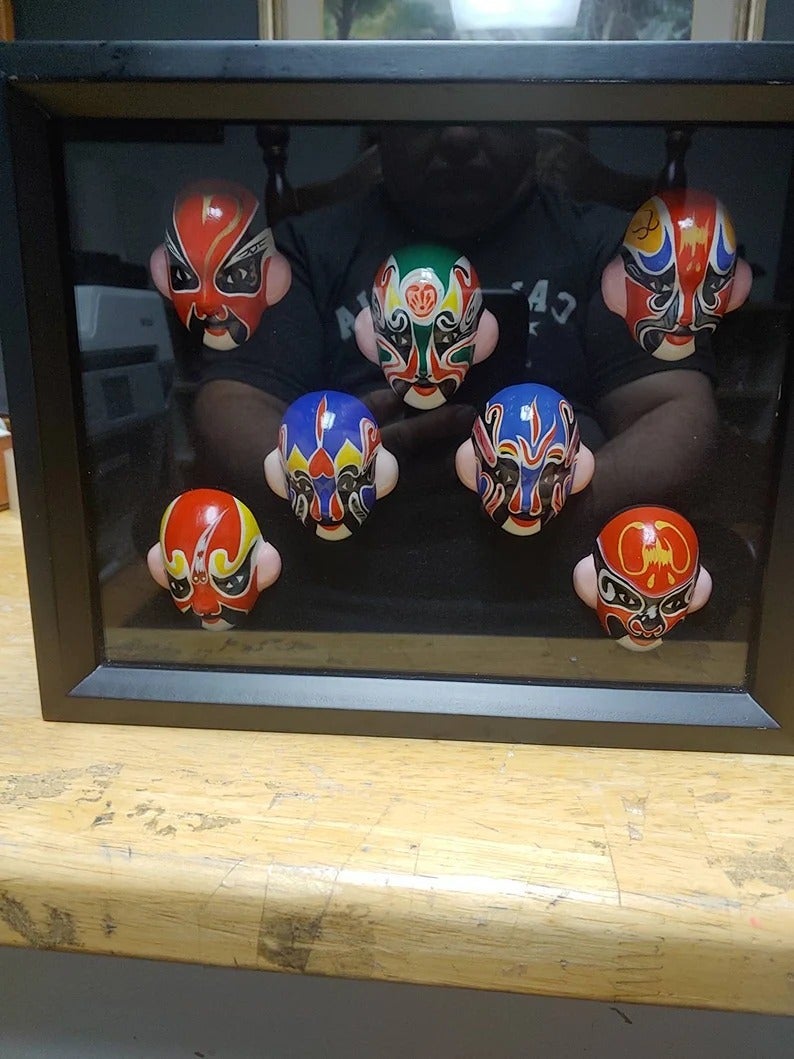 A collection of 7 Kabuki miniature Mask in shadow box Circa. 1980