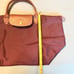Longchamp Women’s Le Pliage Medium Top Handle Nylon Tote Plum