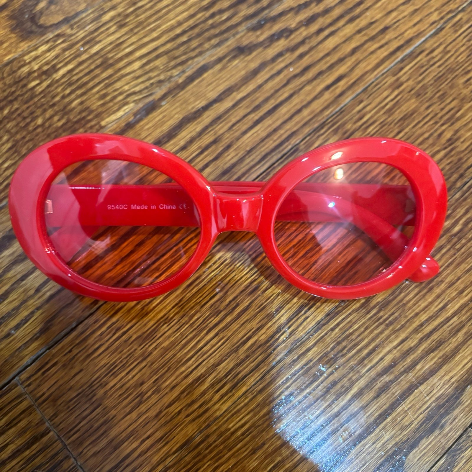 Red round sunglasses with red lens