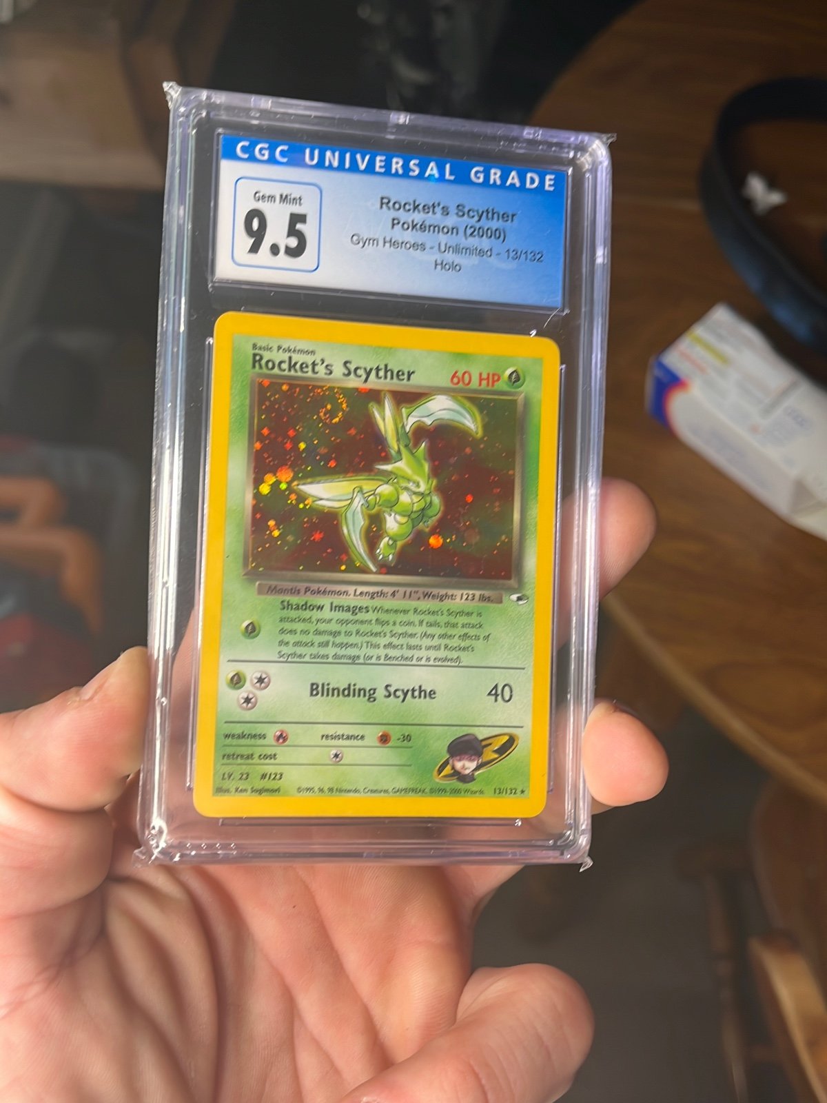 2000 Pokémon CGC 9.5 Gym Hero’s Rocket’s Scyther-Holo with swirls.