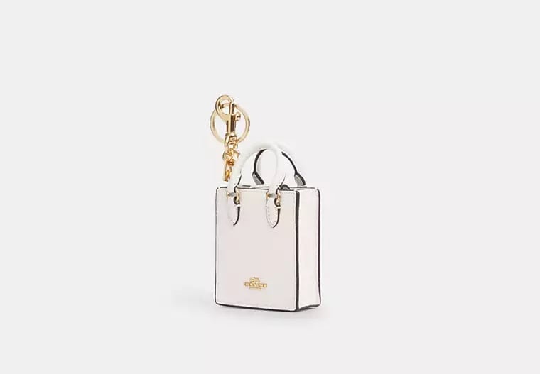 Coach North/South Mini Tote Bag Charm in Gold/Chalk Pebble Leather White NWT