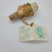 Spit 'N' Whittle, inc N. D. Ruff Bottle Stopper.