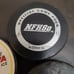 Hockey pucks in a lot of four