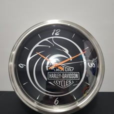 2006 Harley Davidson Wall clock in shape of a rim.