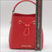MICHAEL KORS SURI SMALL BUCKET XBODY FLA