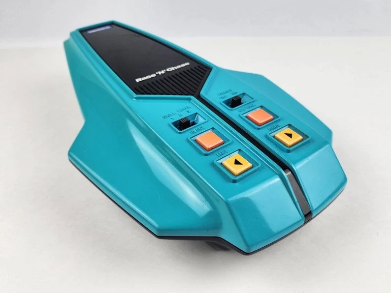 Bambino Race & Chase Handheld video game Teal Blue Frogger Style game -works-