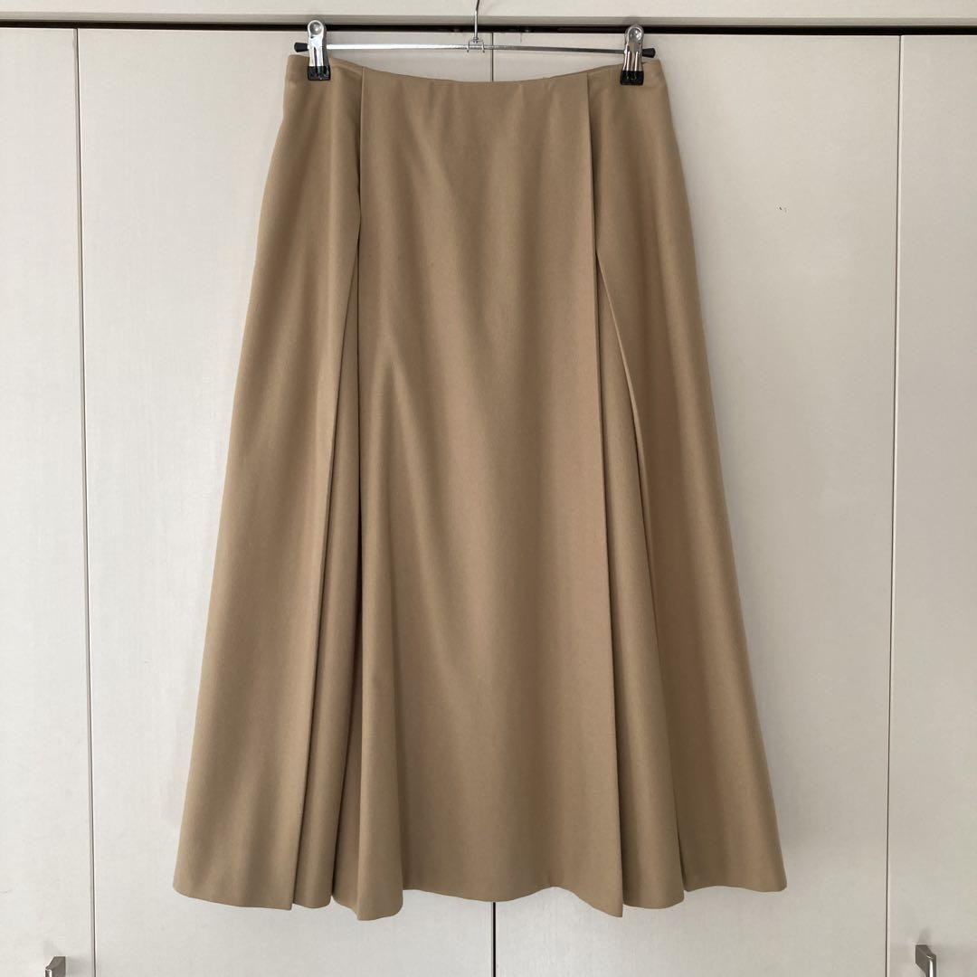 Beige flared skirt with back zipper, size 40.