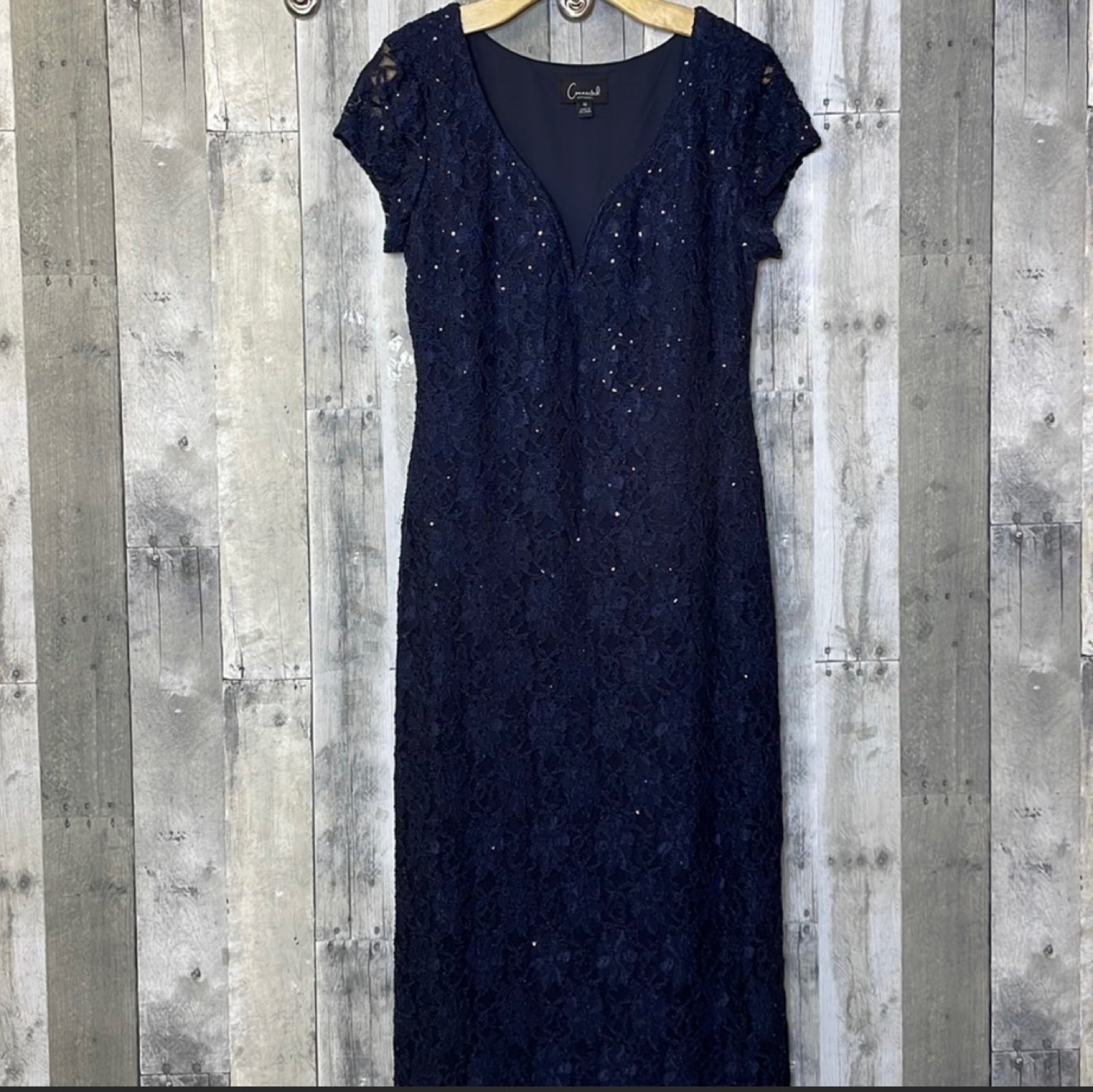 NWT navy sequin lace floor length dress with side slit. Side slit on left hand s