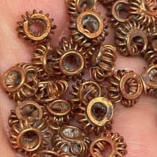 Lot of 125 5mm copper wire saucer beads. 5513